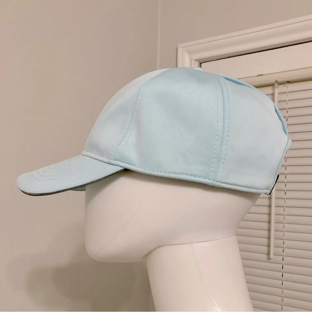 light blue baseball cap with reflective stripe on the peak self-adjusting .